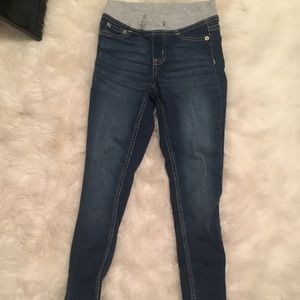 Dark blue jeans with gray on top